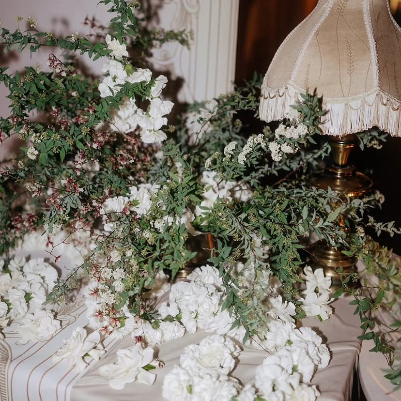 White floral tablescape with greenery